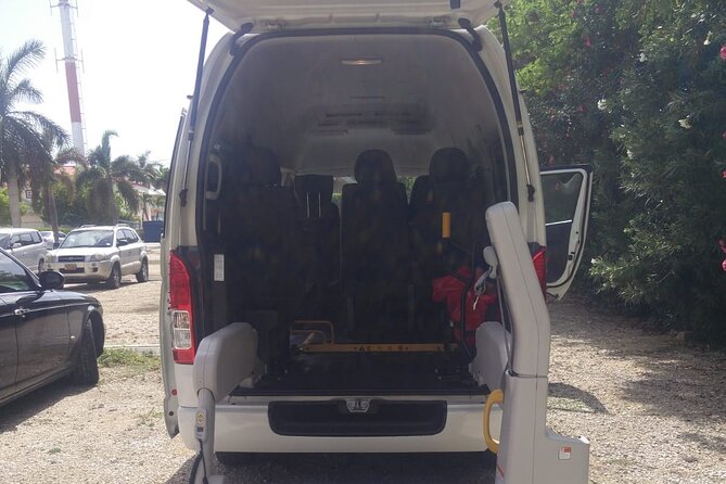 Airport Transfer to West Bay Accommodations (GCM)-Round Trip - The return trip and the airport clock
