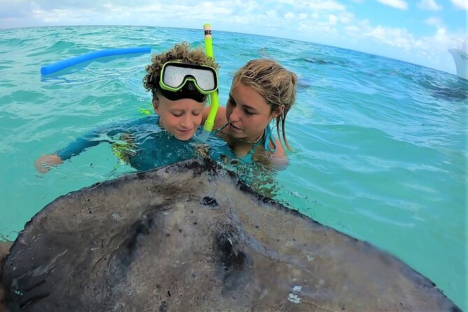 Private Charter 28ft Grady White. Stingrays, Snorkeling, Starfish - Coral reef snorkeling with help in the water