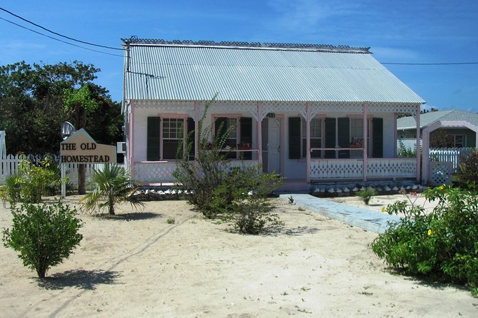 West Bay Sightseeing Tour Plus Seven Mile Beach Visit - Georgetown, waterfront views, and old island homes